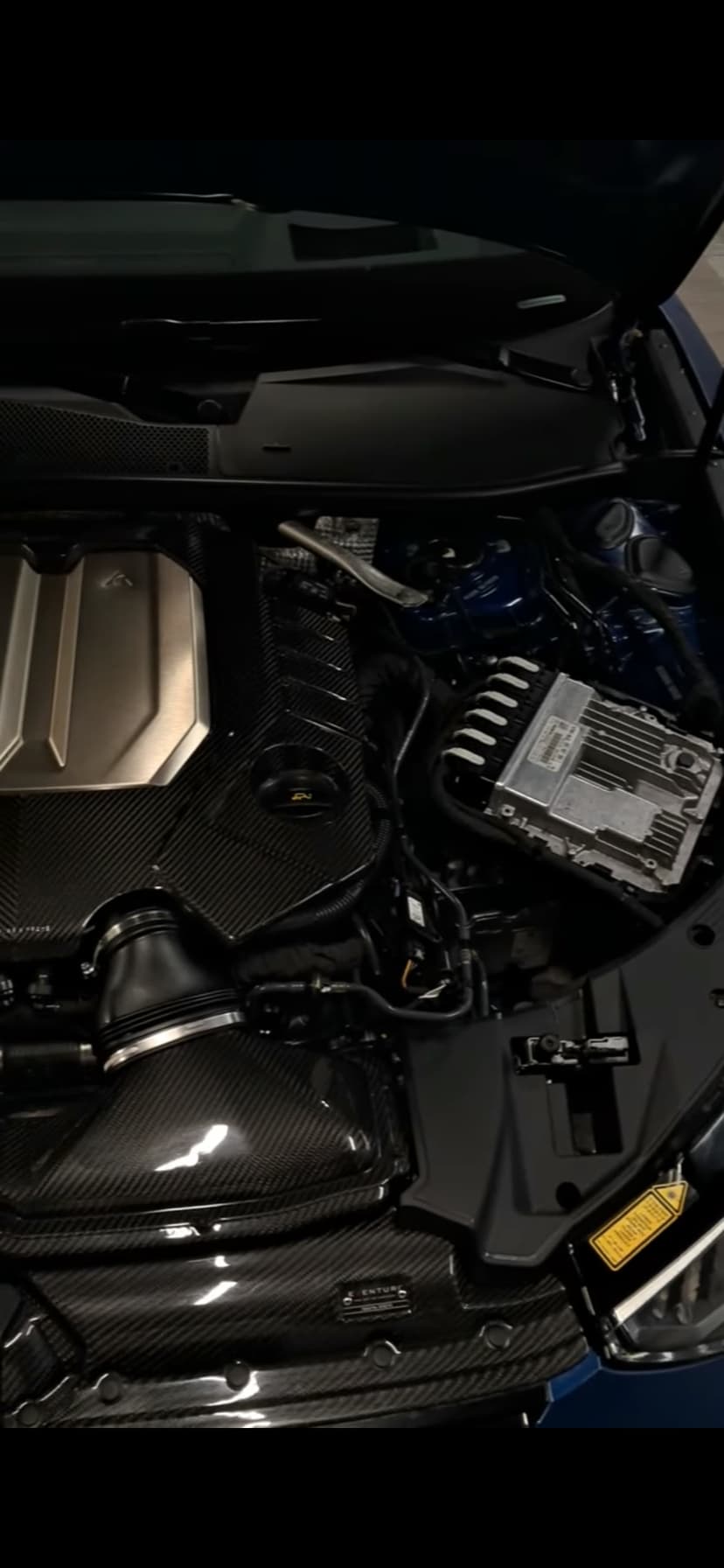 Bentley engine bay with carbon fiber covers