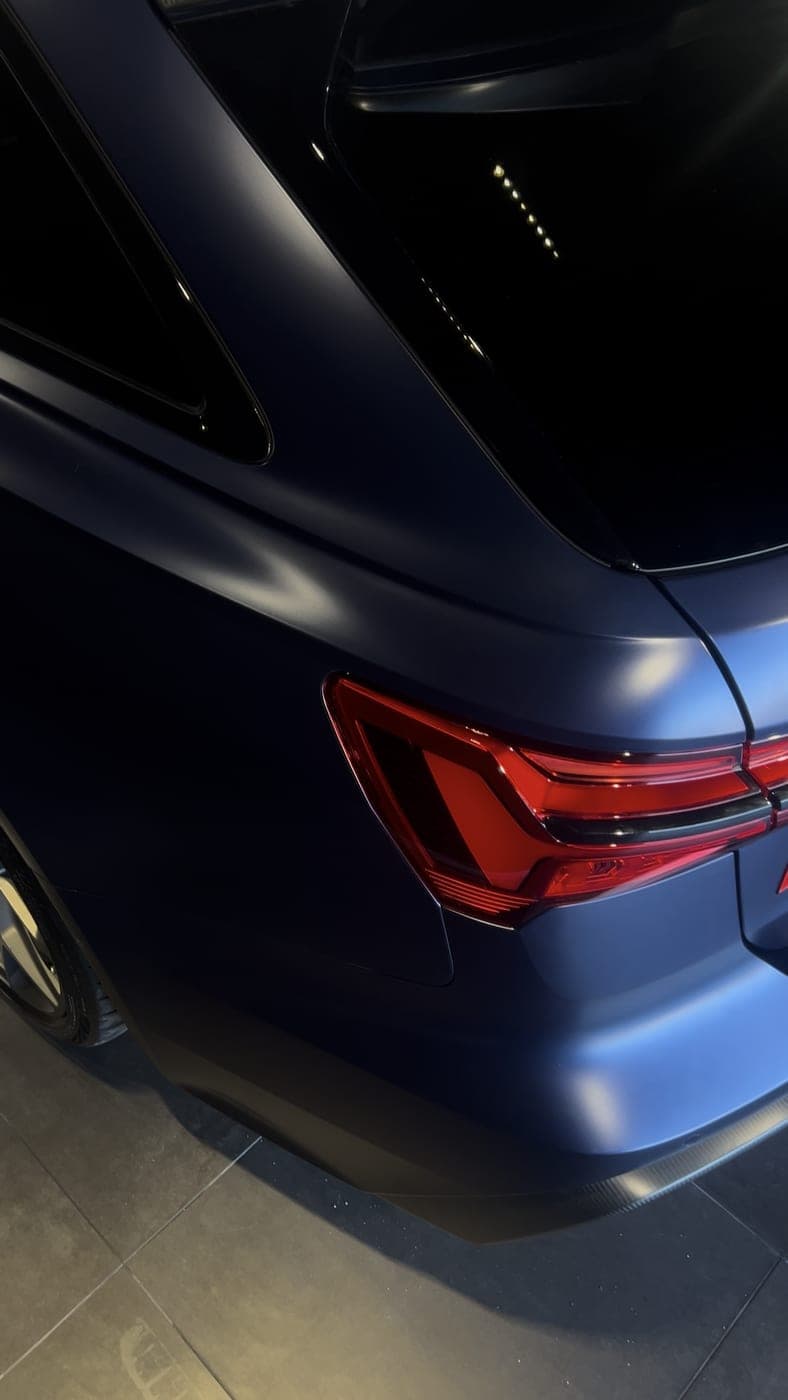 Audi RS6 in matte blue, rear quarter and tail light
