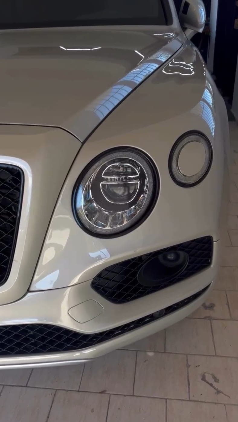White Bentley Bentayga front end after detailing