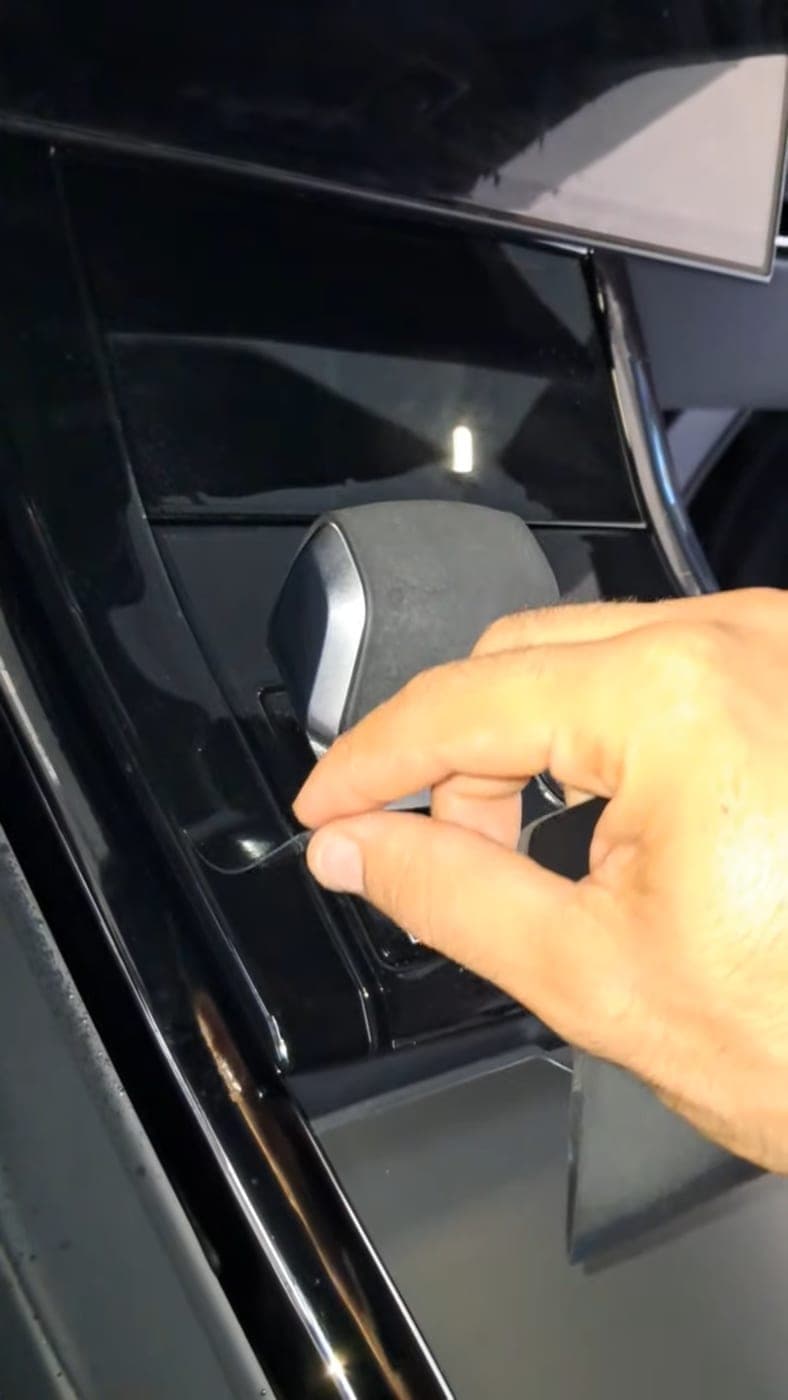 Tucking a film edge behind window trim