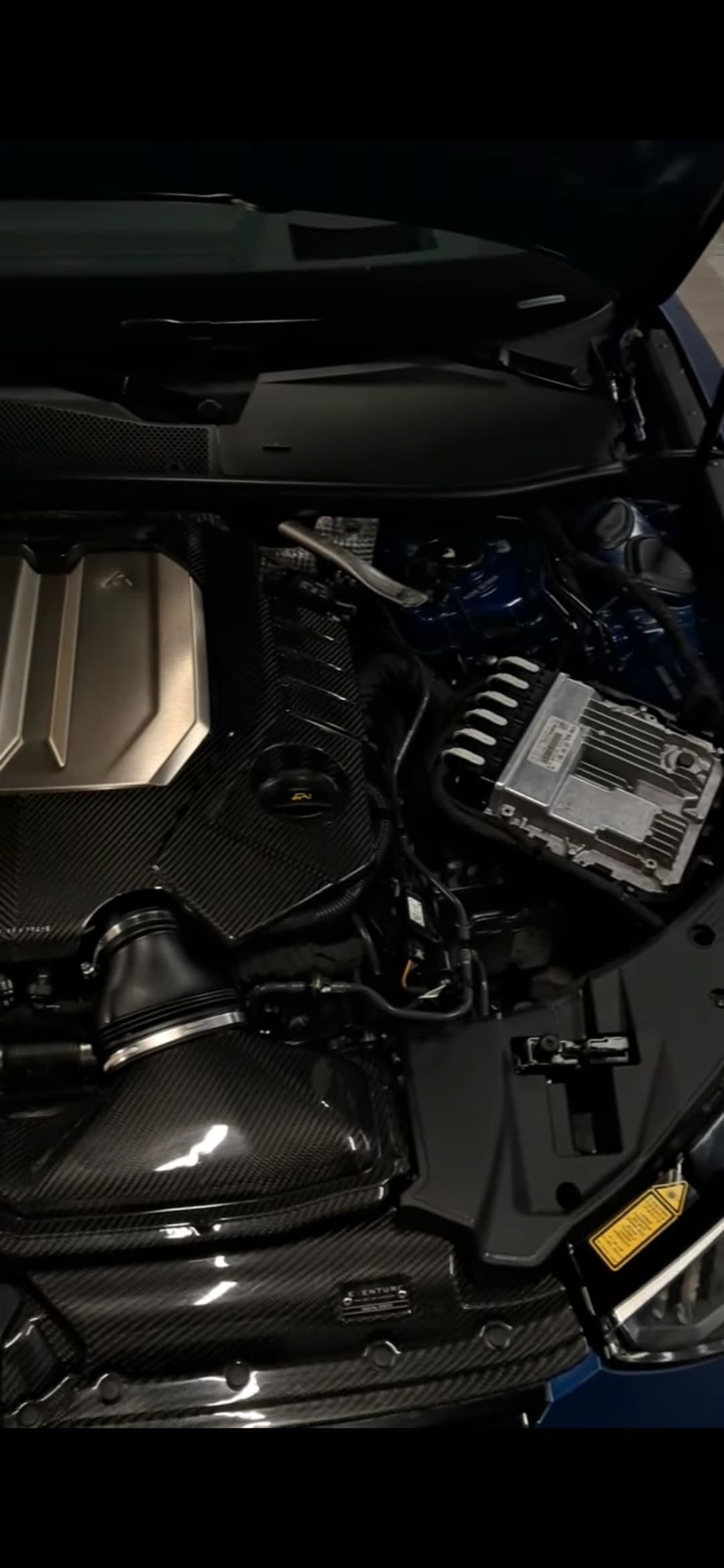 Bentley engine bay with carbon fiber covers