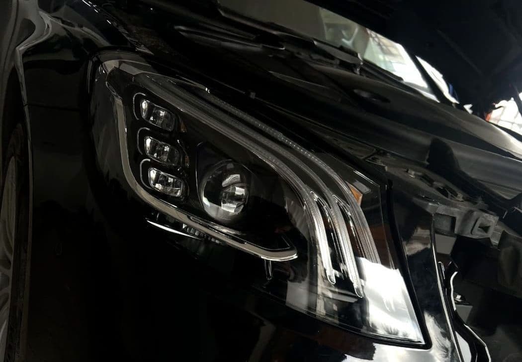 Black Mercedes S-Class front end and headlight